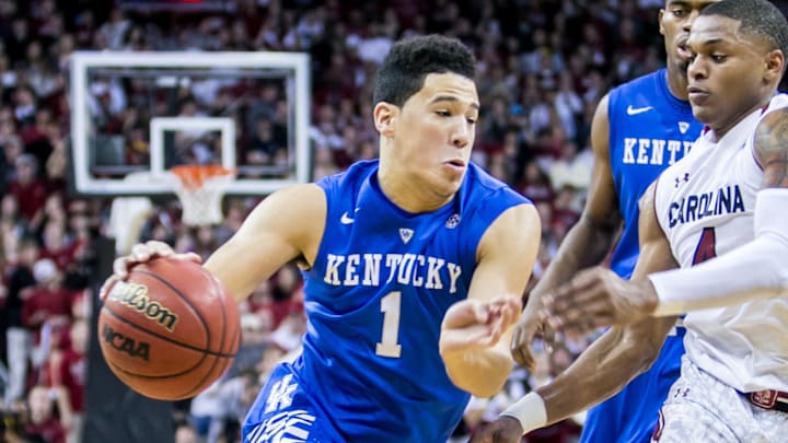 Jan 24, 2015; Columbia, SC, USA; Kentucky Wildcats guard Devin Booker (1) drives around South Carolina Gamecocks guard Tyrone Johnson (4) in the first half at Colonial Life Arena. Mandatory Credit: Jeff Blake-Imagn Images