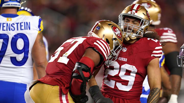 Dec 12, 2024; Santa Clara, California, USA; San Francisco 49ers linebacker Dre Greenlaw (57) is congratulated by safety Talanoa Hufanga (29) after making a tackle against the Los Angeles Rams in the first quarter at Levi's Stadium. Mandatory Credit: Cary Edmondson-Imagn Images