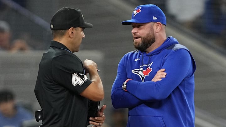 Jul 3, 2025; Toronto, Ontario, CAN; Toronto Blue Jays manager John Schneider talks to home plate umpire Gabe Morales after calling out Toronto Blue Jays first baseman Vladimir Guerrero (not pictured) on strikes during the eighth inning against the New York Yankees at Rogers Centre. 