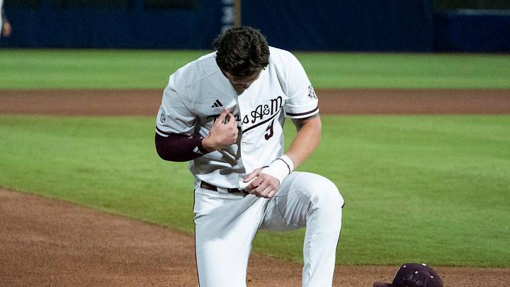 Texas A&M Aggies' Gavin Grahovac (9) prays before Auburn Tigers take on Texas A&M Aggies during the SEC baseball tournament at Hoover Metropolitan Stadium in Hoover, Ala. on Friday, May 22, 2026. Texas A&M Aggies' Gavin Grahovac (9) prays before Auburn Tigers take on Texas A&M Aggies during the SEC baseball tournament at Hoover Metropolitan Stadium in Hoover, Ala. on Friday, May 22, 2026.