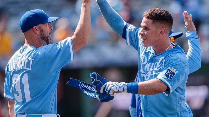 Kansas City Royals catcher Freddy Fermin (34) high fives Kansas City Royals senior director of hitting Kansas City Royals catcher Freddy Fermin (34) high fives Kansas City Royals senior director of hitting