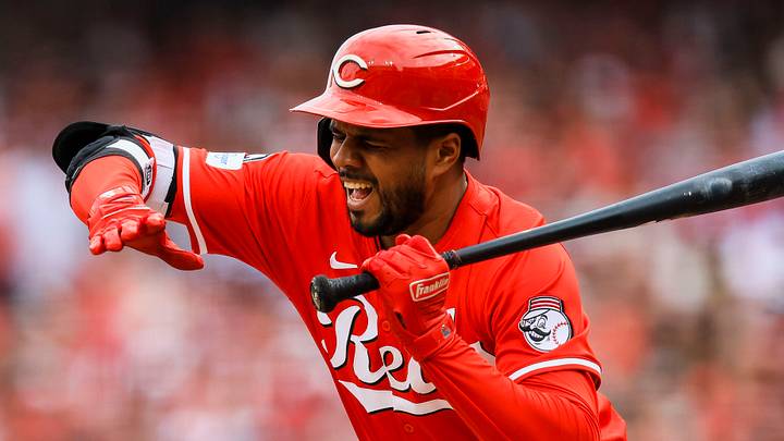 Cincinnati Reds designated hitter Jeimer Candelario (3) dodges a wild pitch