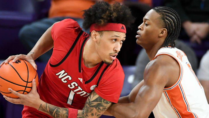 NC State Wolfpack forward Darrion Williams (1) is defended by Clemson Tigers forward RJ Godfrey (0) Tuesday, Jan. 20, 2026, during the NCAA men’s basketball game at Littlejohn Coliseum in Clemson, South Carolina.