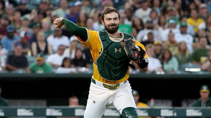 The A’s catcher possesses a strong arm behind the plate in addition to his powerful bat. The A’s catcher possesses a strong arm behind the plate in addition to his powerful bat.