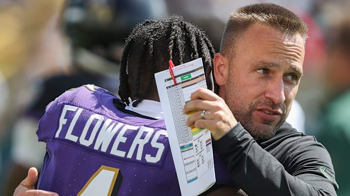 Baltimore Ravens receiver Zay Flowers hugs Green Bay Packers defensive coordinator Jeff Hafley during a joint practice in 2024.