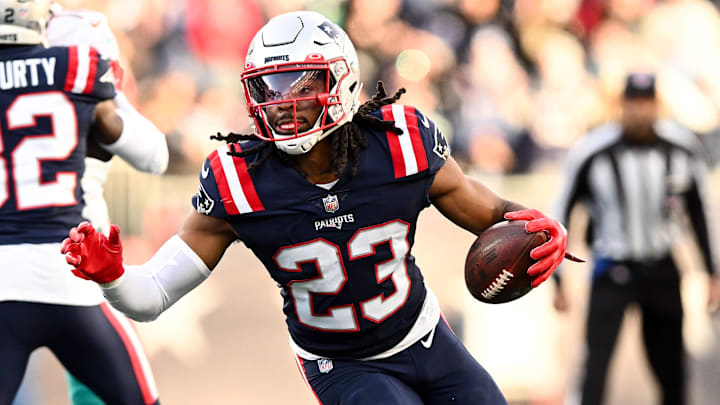 Jan 1, 2023; Foxborough, Massachusetts, USA; New England Patriots safety Kyle Dugger (23) runs for a touchdown after intercepting the ball during the second half of agame against the Miami Dolphins at Gillette Stadium. Mandatory Credit: Brian Fluharty-Imagn Images