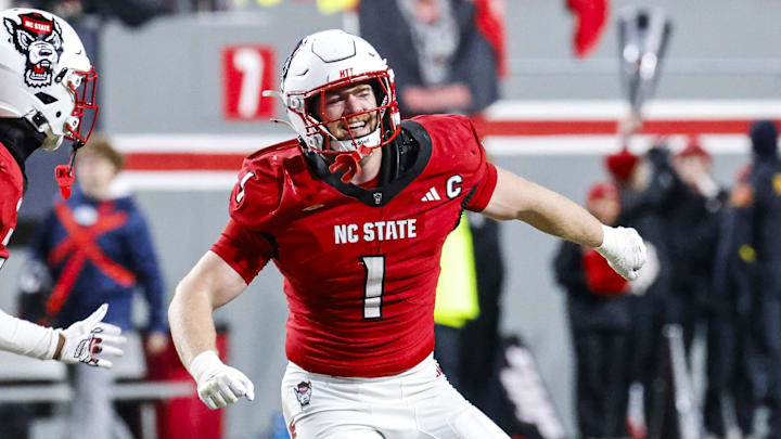 Nov 29, 2025; Raleigh, North Carolina, USA;  NC State Wolfpack linebacker Caden Fordham (1) reacts to a down with NC State Wolfpack wide receiver Sam Dodd (28) and NC State Wolfpack quarterback Cole Wilson (19) during the second half of the game against the North Carolina Tar Heels at Carter-Finley Stadium.  Mandatory Credit: Jaylynn Nash-Imagn Images