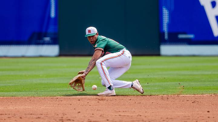 May 23, 2024; Charlotte, NC, USA; Miami (Fl) Hurricanes infielder Antonio Jimenez (13) field a ground ball against the Clemson Tigers during the second inning during the ACC Baseball Tournament at Truist Field. Mandatory Credit: Scott Kinser-USA TODAY Sports