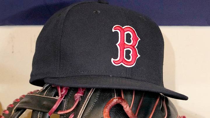 May 27, 2025; Milwaukee, Wisconsin, USA; A Boston Red Sox hat and glove sit in the dug out before a game against the Milwaukee Brewers at American Family Field. May 27, 2025; Milwaukee, Wisconsin, USA; A Boston Red Sox hat and glove sit in the dug out before a game against the Milwaukee Brewers at American Family Field.