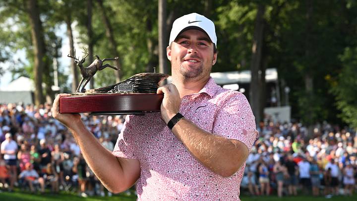 Chris Gotterup holds the winner's trophy after his victory at the 2026 John Deere Classic