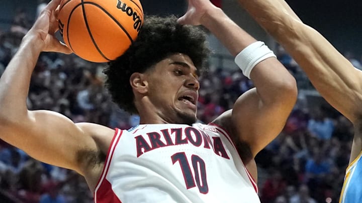 Mar 20, 2026; San Diego, CA, USA; Arizona Wildcats forward Koa Peat (10) controls the ball against LIU Sharks center Isaiah Miranda (7) in the first half during a first round game of the men's 2026 NCAA Tournament at Viejas Arena. Mandatory Credit: Kirby Lee-Imagn Images Mar 20, 2026; San Diego, CA, USA; Arizona Wildcats forward Koa Peat (10) controls the ball against LIU Sharks center Isaiah Miranda (7) in the first half during a first round game of the men's 2026 NCAA Tournament at Viejas Arena. Mandatory Credit: Kirby Lee-Imagn Images