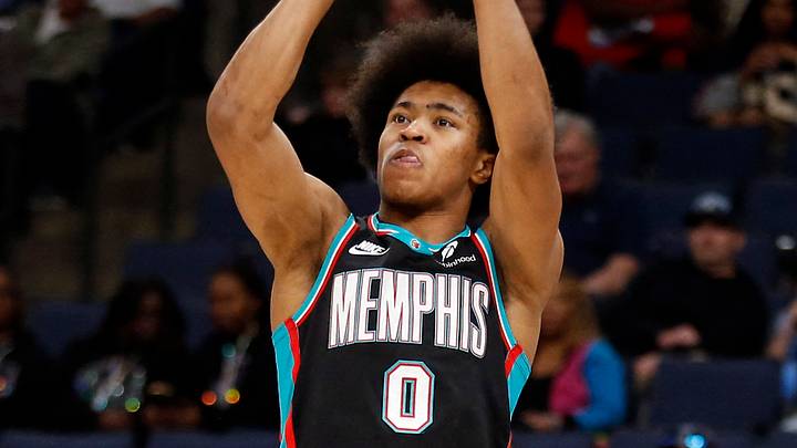 Mar 18, 2026; Memphis, Tennessee, USA; Memphis Grizzlies forward Jaylen Wells (0) shoots as Denver Nuggets guard Julian Strawther (3) defends during the second quarter at FedExForum. Mandatory Credit: Petre Thomas-Imagn Images Mar 18, 2026; Memphis, Tennessee, USA; Memphis Grizzlies forward Jaylen Wells (0) shoots as Denver Nuggets guard Julian Strawther (3) defends during the second quarter at FedExForum. Mandatory Credit: Petre Thomas-Imagn Images