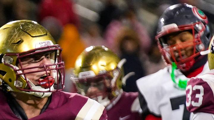Bishop Watterson's Jack Schuler (87) celebrates after CJ Youell (40) got a sack against Toledo Central Catholic in the second half of the Division III State Championship game at Tom Benson Hall of Fame Stadium on Friday, Dec. 6, 2024 in Canton, Ohio.