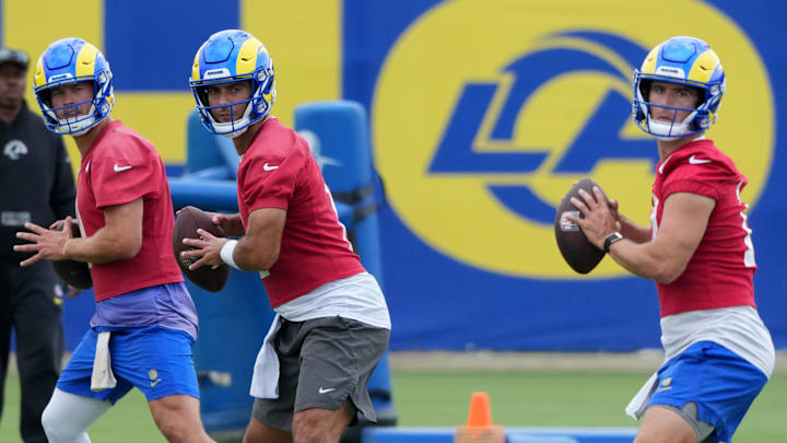 Jun 3, 2025; Woodland Hills, CA, USA; Los Angeles Rams quarterbacks Matthew Stafford (left), Jimmy Garoppolo (center) and Stetson Bennett throw the ball during organized team activities at Rams Practice Facility. Mandatory Credit: Kirby Lee-Imagn Images Jun 3, 2025; Woodland Hills, CA, USA; Los Angeles Rams quarterbacks Matthew Stafford (left), Jimmy Garoppolo (center) and Stetson Bennett throw the ball during organized team activities at Rams Practice Facility. Mandatory Credit: Kirby Lee-Imagn Images