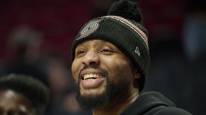 Nov 30, 2025; Portland, Oregon, USA; Portland Trail Blazers guard Damian Lillard (0) shares a laugh before a game against the Oklahoma City Thunder at Moda Center. Mandatory Credit: Troy Wayrynen-Imagn Images
