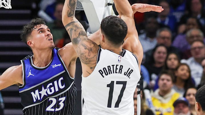 Nov 14, 2025; Orlando, Florida, USA; Brooklyn Nets forward Michael Porter Jr. (17) is fouled by Orlando Magic forward Tristan da Silva (23) during the second half at Kia Center. Mandatory Credit: Mike Watters-Imagn Images Nov 14, 2025; Orlando, Florida, USA; Brooklyn Nets forward Michael Porter Jr. (17) is fouled by Orlando Magic forward Tristan da Silva (23) during the second half at Kia Center. Mandatory Credit: Mike Watters-Imagn Images