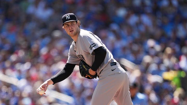 Jun 13, 2026; Toronto, Ontario, CAN; New York Yankees starting pitcher Cam Schlittler (31) looks over at first base against the Toronto Blue Jays during the second inning at Rogers Centre. Mandatory Credit: Nick Turchiaro-Imagn Images