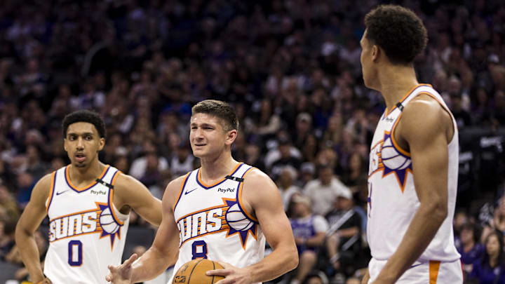 Apr 13, 2025; Sacramento, California, USA;  Phoenix Suns guard Grayson Allen (8) and forward Ryan Dunn (0) react during the second quarter against the Sacramento Kings at Golden 1 Center. Mandatory Credit: John Hefti-Imagn Images