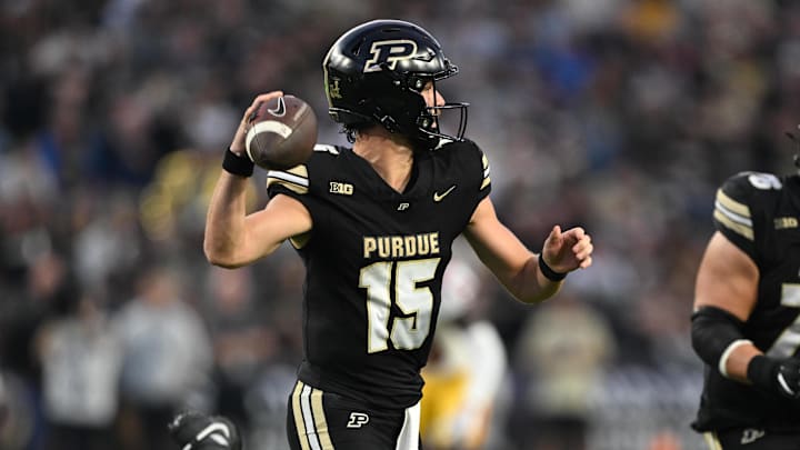 Purdue Boilermakers quarterback Ryan Browne (15) throws a pass