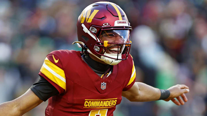 Dec 22, 2024; Landover, Maryland, USA; Washington Commanders quarterback Jayden Daniels (5) celebrates after throwing a touchdown during the fourth quarter against the Philadelphia Eagles at Northwest Stadium. Mandatory Credit: Peter Casey-Imagn Images Dec 22, 2024; Landover, Maryland, USA; Washington Commanders quarterback Jayden Daniels (5) celebrates after throwing a touchdown during the fourth quarter against the Philadelphia Eagles at Northwest Stadium. Mandatory Credit: Peter Casey-Imagn Images