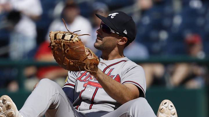 Apr 23, 2026; Washington, District of Columbia, USA; Atlanta Braves first baseman Matt Olson (28) sits on the dirt at first base after catching a throw to first base by Braves third baseman Austin Riley (not pictured) on a ground ball by Washington Nationals third baseman José Tena (not pictured) during the ninth inning at Nationals Park. Mandatory Credit: Geoff Burke-Imagn Images