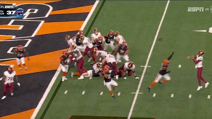 Daniels throws a touchdown pass to Trent Scott during Monday's game against the Bengals. 