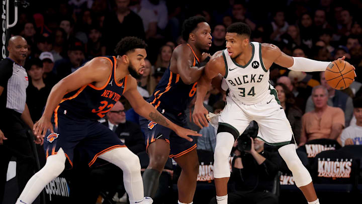 Nov 8, 2024; New York, New York, USA; Milwaukee Bucks forward Giannis Antetokounmpo (34) controls the ball against New York Knicks forward OG Anunoby (8) and center Karl-Anthony Towns (32) during the third quarter at Madison Square Garden. Mandatory Credit: Brad Penner-Imagn Images