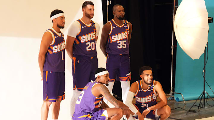 Sep 30, 2024; Phoenix, AZ, USA; Phoenix Suns guard Devin Booker (1) and Phoenix Suns center Jusuf Nurkic (20) and Phoenix Suns forward Kevin Durant (35) and Phoenix Suns guard Bradley Beal (3) and Phoenix Suns guard Tyus Jones (21) pose for a photo during Media Day at Footprint Center. Mandatory Credit: Joe Camporeale-Imagn Images