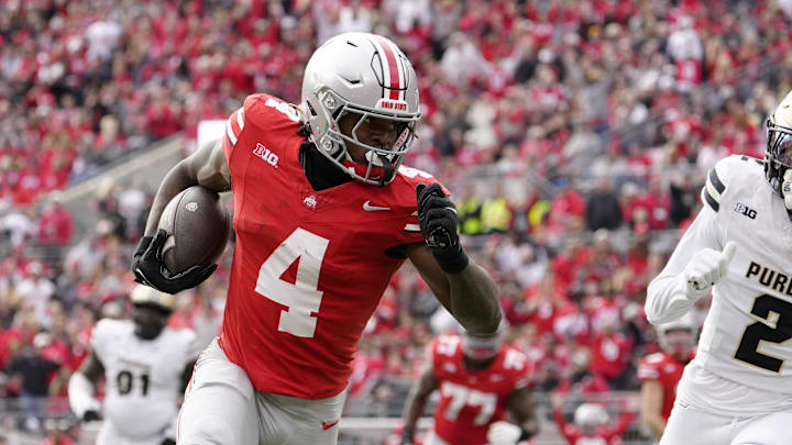 Nov 9, 2024; Columbus, Ohio, USA; Ohio State Buckeyes wide receiver Jeremiah Smith (4) dances into the end zone untouched by Purdue Boilermakers defensive back Nyland Green (2) during the first half  at Ohio Stadium. 