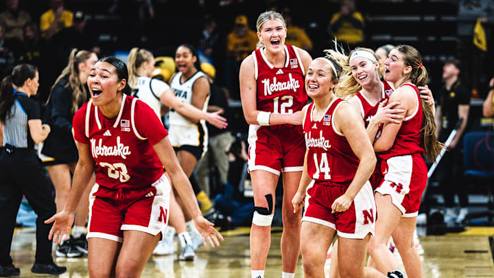 The Huskers celebrate their overtime win in Iowa City.