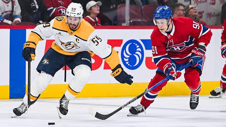 Oct 16, 2025; Montreal, Quebec, CAN; Nashville Predators defenseman Roman Josi (59) plays the puck against Montreal Canadiens center Oliver Kapanen (91) during the first period at Bell Centre. Mandatory Credit: David Kirouac-Imagn Images Oct 16, 2025; Montreal, Quebec, CAN; Nashville Predators defenseman Roman Josi (59) plays the puck against Montreal Canadiens center Oliver Kapanen (91) during the first period at Bell Centre. Mandatory Credit: David Kirouac-Imagn Images