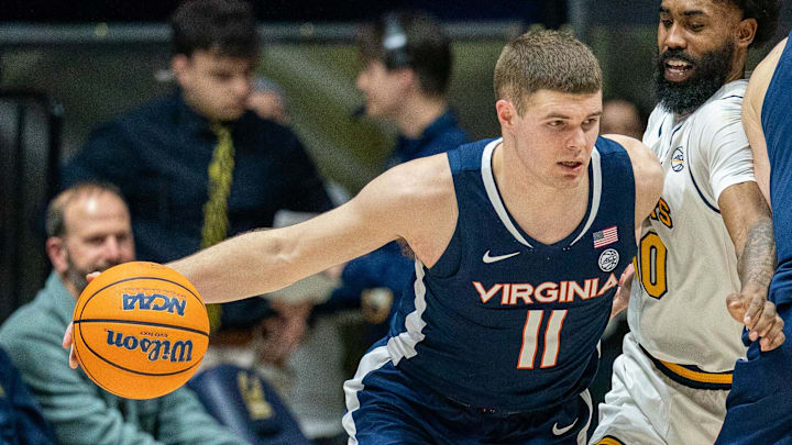 Jan 8, 2025; Berkeley, California, USA; Virginia Cavaliers guard Isaac McKneely (11) controls the basketball against California Golden Bears guard Jovan Blacksher Jr. (10) during the second half at Haas Pavilion. Mandatory Credit: Neville E. Guard-Imagn Images Jan 8, 2025; Berkeley, California, USA; Virginia Cavaliers guard Isaac McKneely (11) controls the basketball against California Golden Bears guard Jovan Blacksher Jr. (10) during the second half at Haas Pavilion. Mandatory Credit: Neville E. Guard-Imagn Images