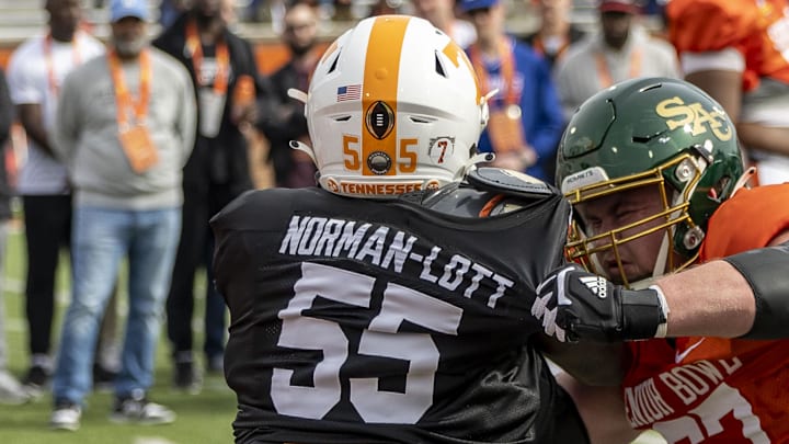 Jan 28, 2025; Mobile, AL, USA; American team defensive lineman Omarr Norman-Lott of Tennessee (55) spars with American team offensive lineman Jackson Slater of Sacramento State (67) during Senior Bowl practice for the American team at Hancock Whitney Stadium. Mandatory Credit: Vasha Hunt-Imagn Images