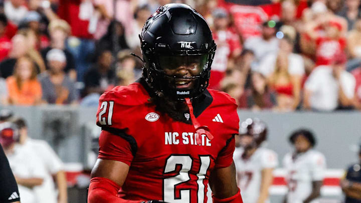 Sep 27, 2025; Raleigh, North Carolina, USA;  North Carolina State Wolfpack cornerback Jamel Johnson (21) celebrates during the first half of the game against Virginia Tech Hokies at Carter-Finley Stadium. Mandatory Credit: Jaylynn Nash-Imagn Images