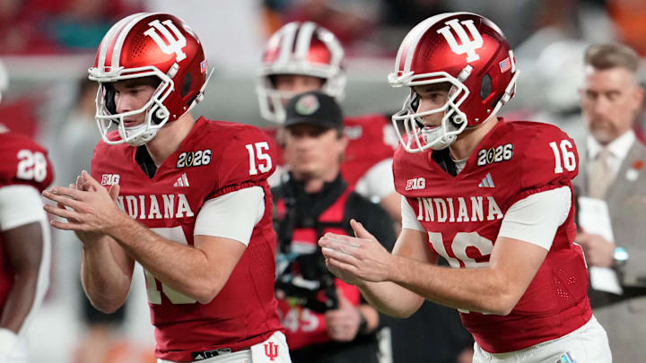 Jan 19, 2026; Miami Gardens, FL, USA; Indiana Hoosiers quarterback Fernando Mendoza (15) and quarterback Alberto Mendoza (16) warm up before the CFP National Championship college football game between the Indiana Hoosiers and the Miami Hurricanes at Hard Rock Stadium. Mandatory Credit: Kirby Lee-Imagn Images