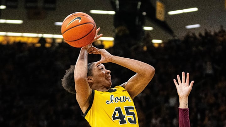 Iowa forward Hannah Stuelke (45) looks to shoot against Minnesota guard Amaya Battle (3) on Feb. 5, 2026, at Carver-Hawkeye Arena. Iowa forward Hannah Stuelke (45) looks to shoot against Minnesota guard Amaya Battle (3) on Feb. 5, 2026, at Carver-Hawkeye Arena.