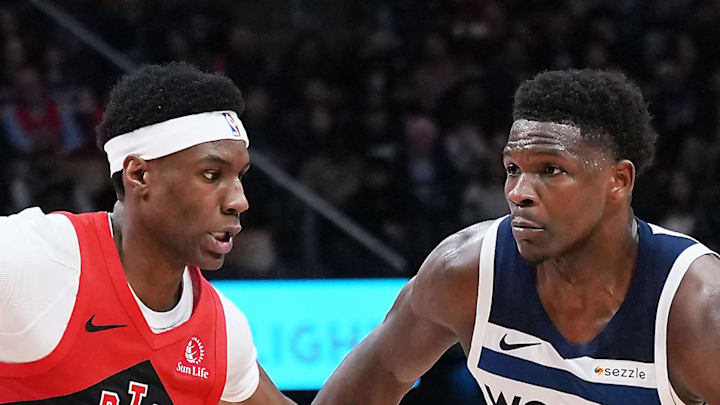 Minnesota Timberwolves guard Anthony Edwards drives against Toronto Raptors guard Ja'Kobe Walter.