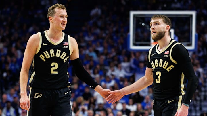 Purdue Boilermakers guard Fletcher Loyer (2) fives guard Braden Smith (3)