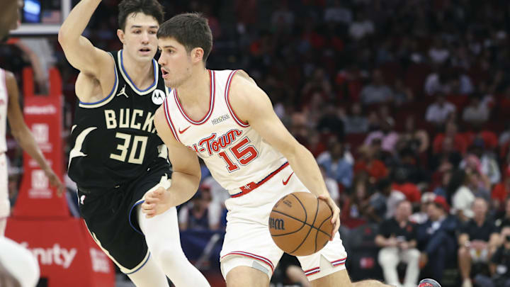 Apr 1, 2026; Houston, Texas, USA; Houston Rockets guard Reed Sheppard (15) dribbles the ball as Milwaukee Bucks guard Cormac Ryan (30) defends during the first quarter at Toyota Center. Mandatory Credit: Troy Taormina-Imagn Images