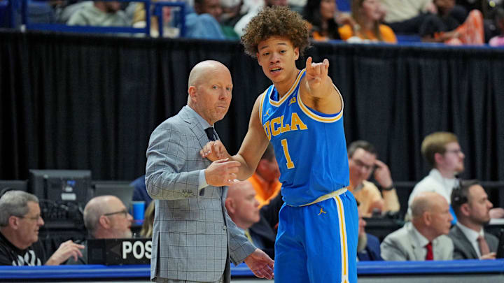 Mar 22, 2025; Lexington, KY, USA; UCLA Bruins head coach Mick Cronin talks with guard Trent Perry (1) during the first half against the Tennessee Volunteers in the second round of the NCAA Tournament at Rupp Arena. Mandatory Credit: Aaron Doster-Imagn Images Mar 22, 2025; Lexington, KY, USA; UCLA Bruins head coach Mick Cronin talks with guard Trent Perry (1) during the first half against the Tennessee Volunteers in the second round of the NCAA Tournament at Rupp Arena. Mandatory Credit: Aaron Doster-Imagn Images