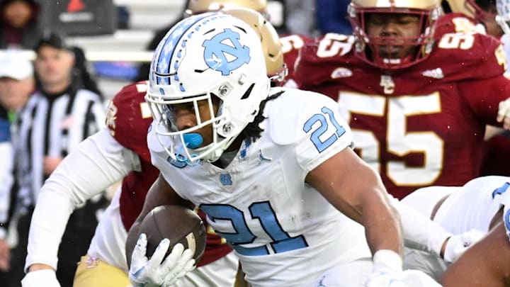 Nov 23, 2024; Chestnut Hill, Massachusetts, USA; North Carolina Tar Heels running back Davion Gause (21) runs for a touchdown against the Boston College Eagles during the second half at Alumni Stadium. 