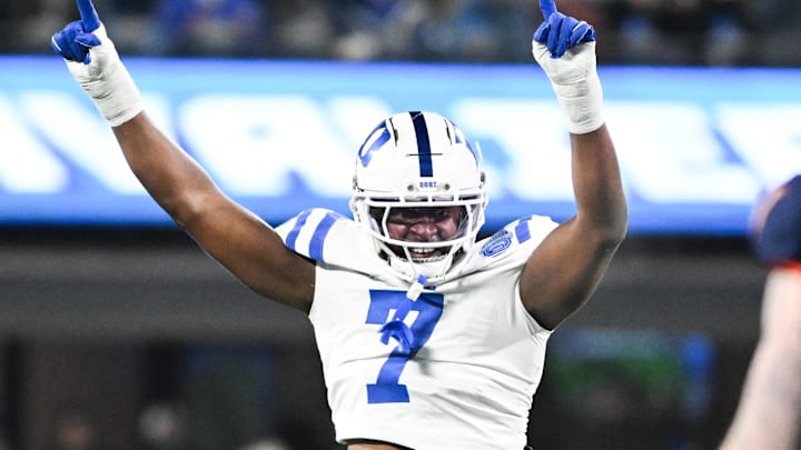 Dec 6, 2025; Charlotte, NC, USA; Duke Blue Devils defensive end Vincent Anthony Jr. (7) reacts after a play in the first quarter against the Virginia Cavaliers during the 2025 ACC Championship game at Bank of America Stadium. Mandatory Credit: Bob Donnan-Imagn Images