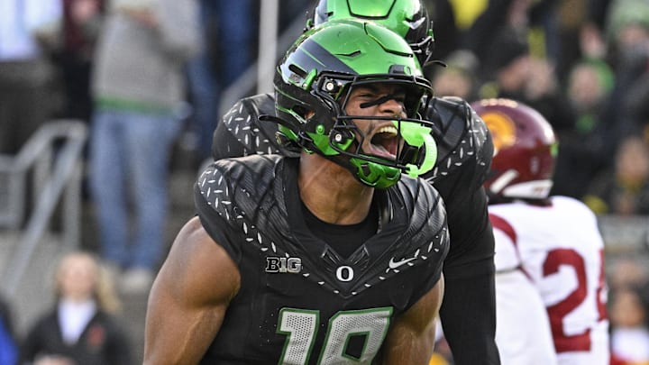 Nov 22, 2025; Eugene, Oregon, USA; Oregon Ducks tight end Kenyon Sadiq (18) celebrates against the Southern California Trojans during the second half at Autzen Stadium. Mandatory Credit: Troy Wayrynen-Imagn Images
