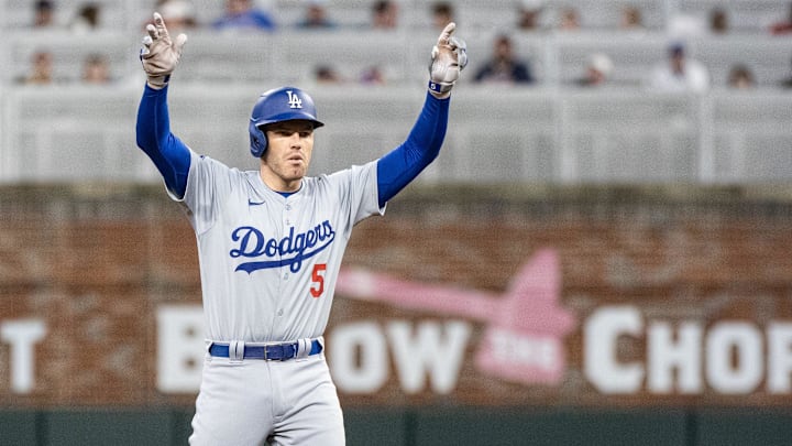 Sep 14, 2024; Cumberland, Georgia, USA; Los Angeles Dodgers first base Freddie Freeman (5) celebrates after hitting a double against the Atlanta Braves during the sixth inning at Truist Park. Mandatory Credit: Jordan Godfree-Imagn Images