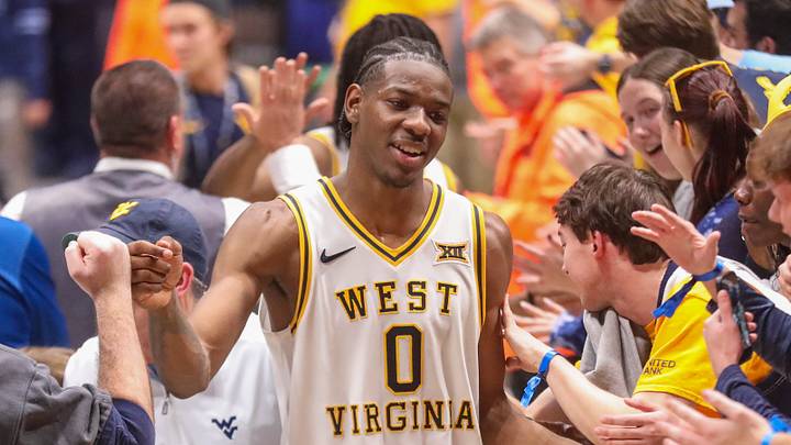 Mar 6, 2026; Morgantown, West Virginia, USA; West Virginia Mountaineers forward Brenen Lorient (0) celebrates with fans after defeating the UCF Knights at Hope Coliseum. Mandatory Credit: Ben Queen-Imagn Images