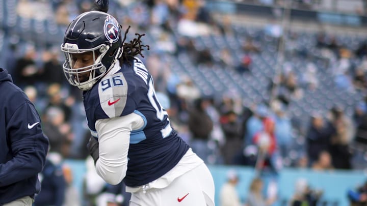 Jan 7, 2024; Nashville, Tennessee, USA;  Tennessee Titans defensive end Denico Autry (96) goes through drills during the pregame warmups at Nissan Stadium. Mandatory Credit: Steve Roberts-Imagn Images