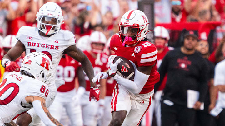 Oct 5, 2024; Lincoln, Nebraska, USA; Nebraska Cornhuskers wide receiver Jaylen Lloyd (19) runs after a catch on a fake punt against the Rutgers Scarlet Knights during the fourth quarter at Memorial Stadium.