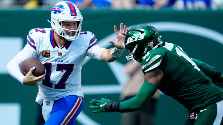 Buffalo Bills quarterback Josh Allen (17) and New York Jets linebacker Jermaine Johnson (11).