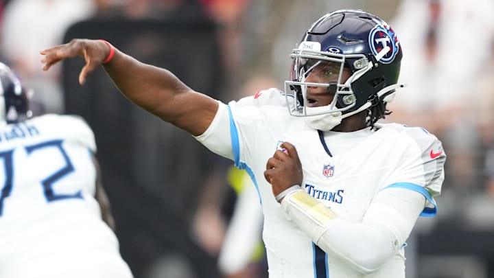 Oct 5, 2025; Glendale, Arizona, USA; Tennessee Titans quarterback Cam Ward (1) makes a throw against the Arizona Cardinals during the fourth quarter at State Farm Stadium. Mandatory Credit: Joe Camporeale-Imagn Images