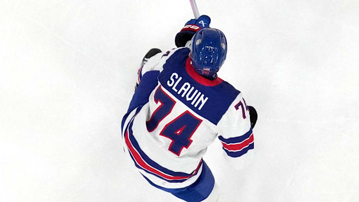 [US, Mexico & Canada customers only] Feb 15, 2026; Milan, Italy; Connor Hellebuyck of United States, Jaccob Slavin of United States, and Brock Faber of United States in action with John Peterka of Germany in men's ice hockey group C play during the Milano Cortina 2026 Olympic Winter Games at Milano Santagiulia Ice Hockey Arena. Mandatory Credit: Marton Monus/Reuters via Imagn Images